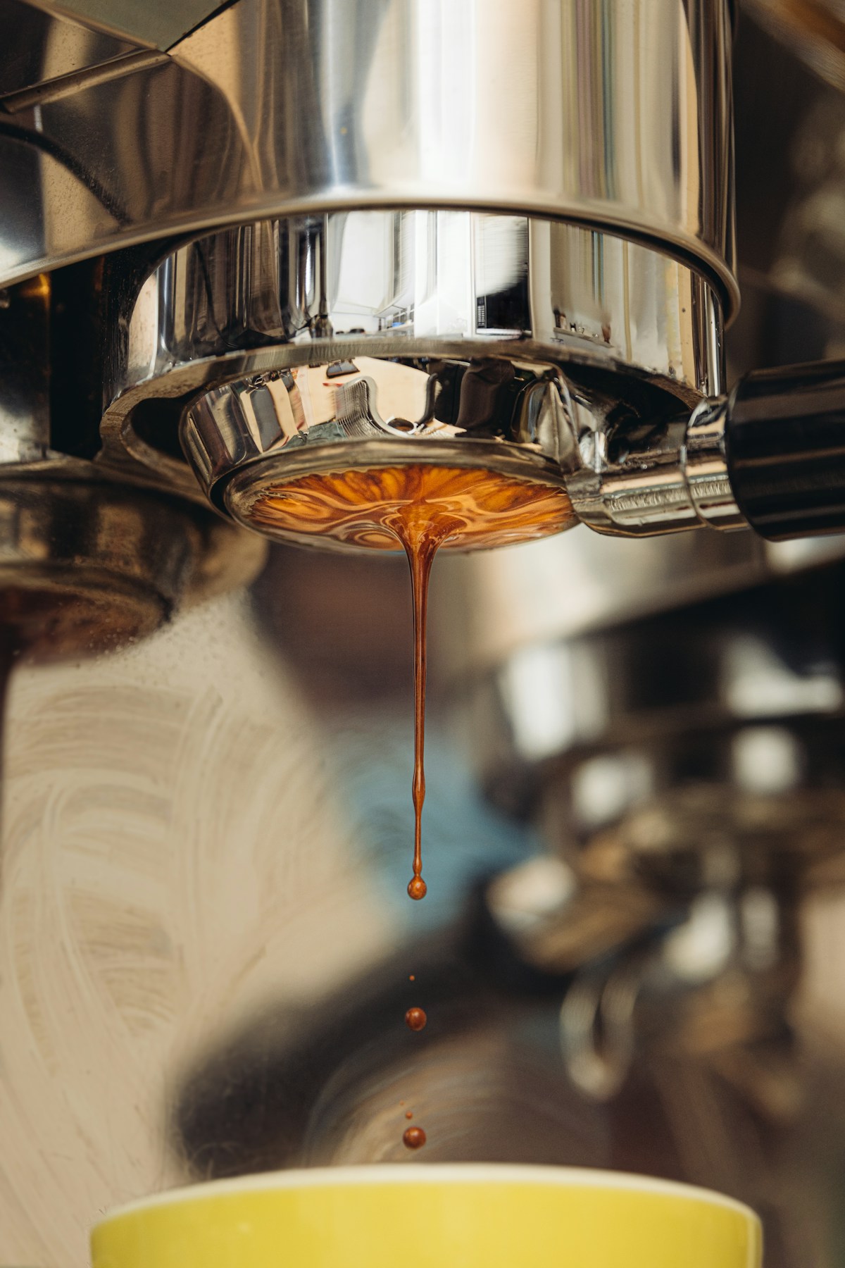 Espresso pouring from a professional machine